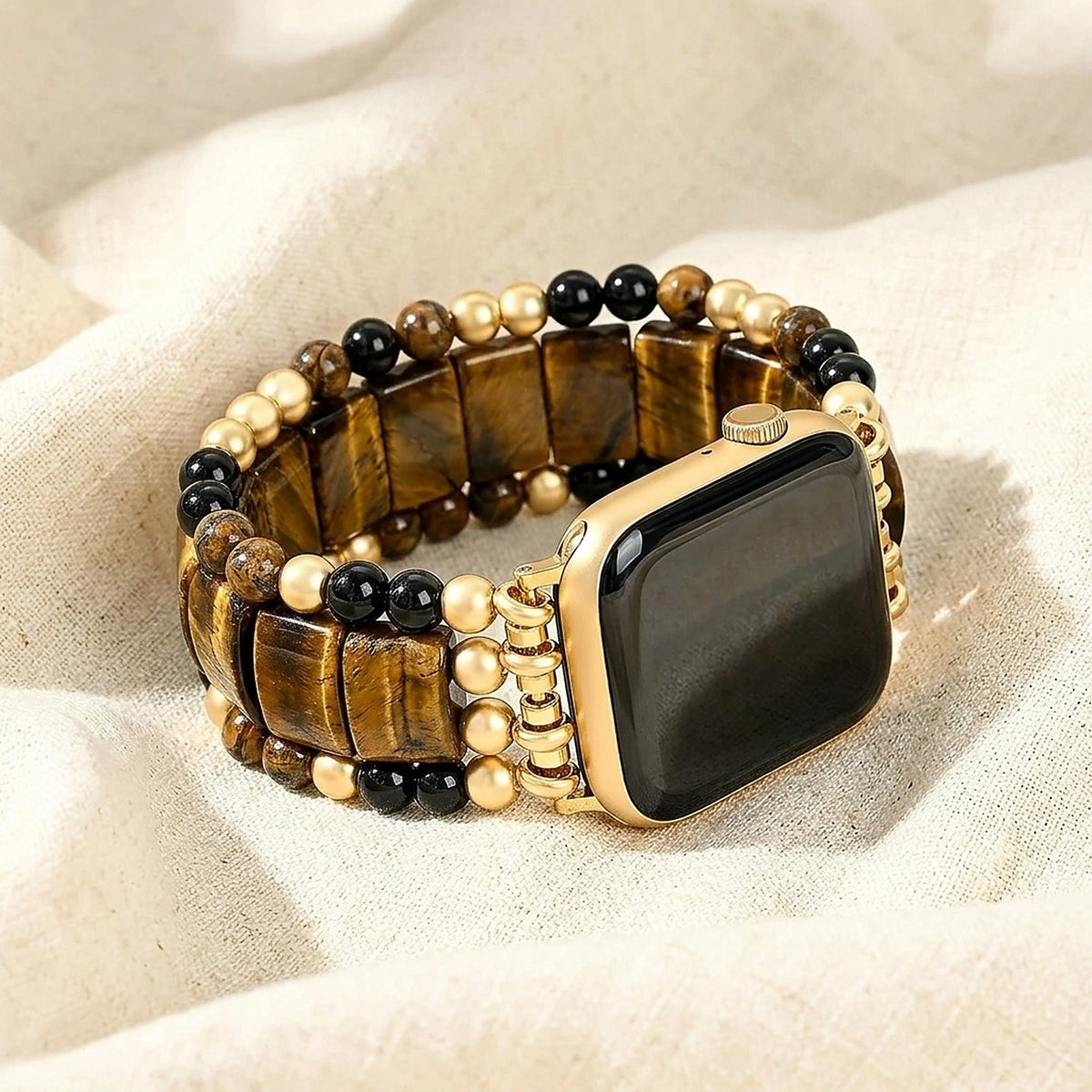 Fearless Heart tiger's eye Apple Watch strap resting on ivory linen