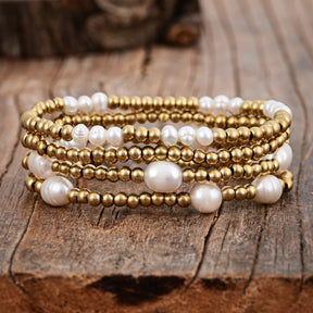 Conjunto de pulseiras de ouro e pérolas